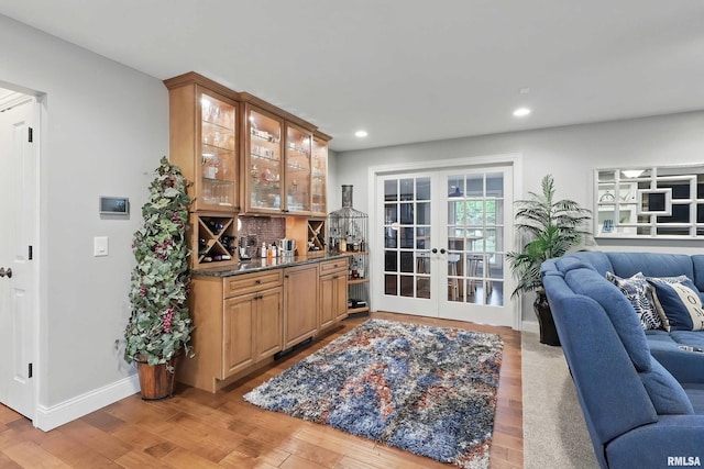 2312 Windsor Dr, Davenport, IA 52807 - indoor dry bar featuring french doors, light wood-type flooring, recessed lighting, and baseboards
