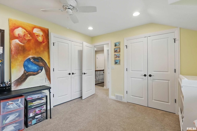 2312 Windsor Dr, Davenport, IA 52807 - bedroom with two closets, light carpet, recessed lighting, and a ceiling fan