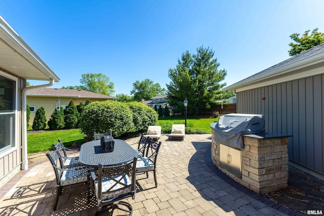 2312 Windsor Dr, Davenport, IA 52807 - view of patio / terrace featuring outdoor dining space and a grill