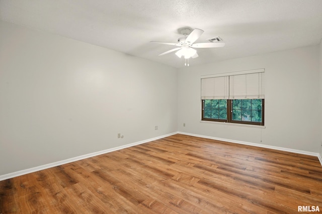 1360 Kimberly Ridge Rd Unit 306, Bettendorf, IA 52722 - empty room with wood finished floors, ceiling fan, and baseboards