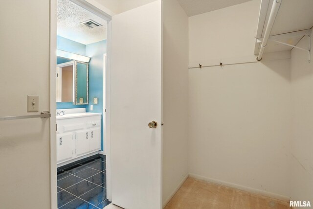 1360 Kimberly Ridge Rd Unit 306, Bettendorf, IA 52722 - bathroom featuring vanity and baseboards