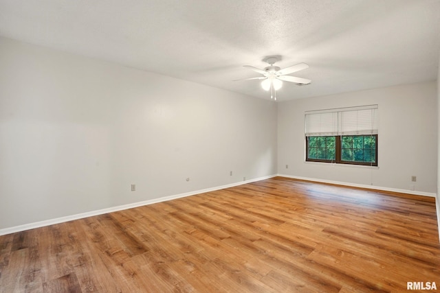 1360 Kimberly Ridge Rd Unit 306, Bettendorf, IA 52722 - spare room featuring ceiling fan, light wood-style flooring, and baseboards