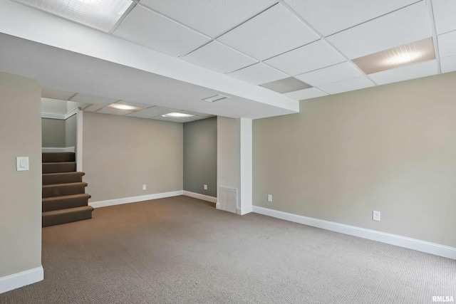3765 Cedarwood Ct, Bettendorf, IA 52722 - finished basement featuring a paneled ceiling, baseboards, carpet floors, and stairway
