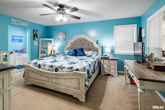 605 Lakeshore Dr S, Goreville, IL 62939 - bedroom with light carpet, ceiling fan, and connected bathroom