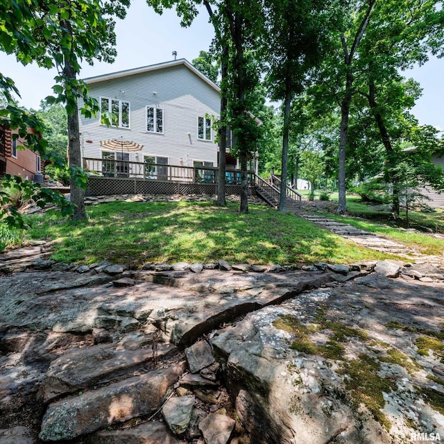 605 Lakeshore Dr S, Goreville, IL 62939 - back of house featuring a deck, stairway, and a yard