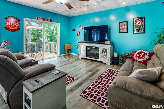 605 Lakeshore Dr S, Goreville, IL 62939 - living area featuring rail lighting, a ceiling fan, and wood finished floors