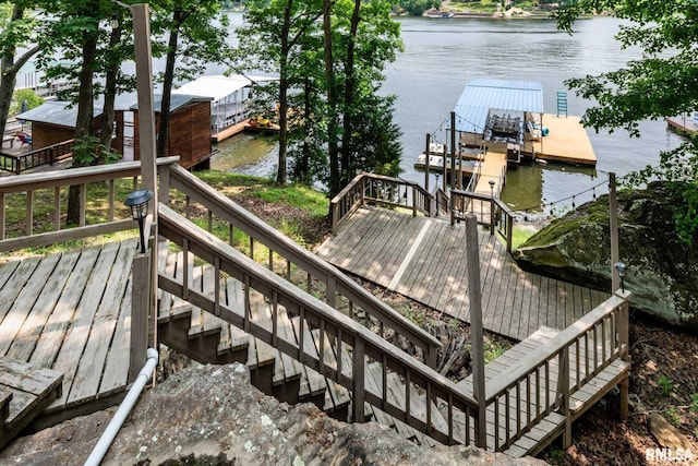 605 Lakeshore Dr S, Goreville, IL 62939 - wooden terrace featuring stairs, a water view, a floating dock, and boat lift