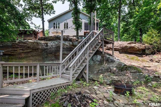 605 Lakeshore Dr S, Goreville, IL 62939 - view of yard featuring stairway, a deck, and an outdoor fire pit