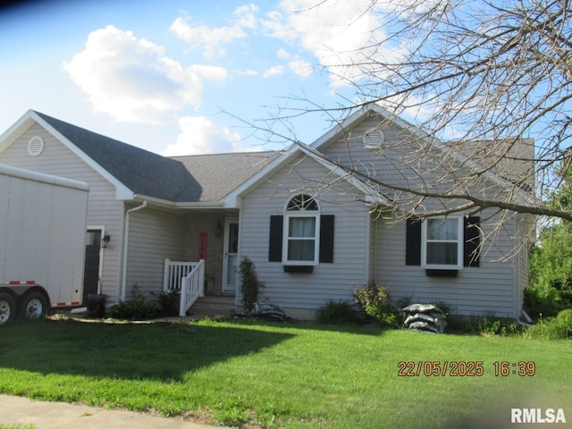 502 Horizon Dr, Tipton, IA 52772 - ranch-style house featuring a front lawn and roof with shingles