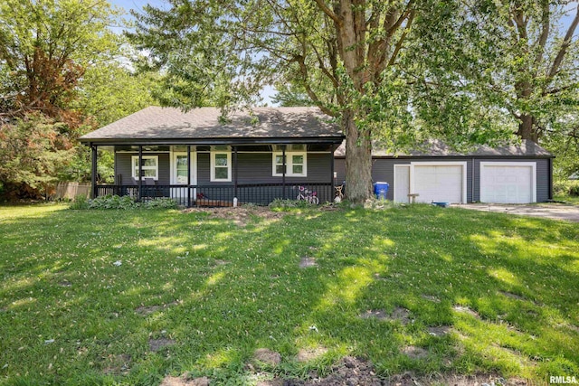 237 W Mill St, Kewanee, IL 61443 - view of front of property with a porch, a front yard, an outbuilding, and a detached garage