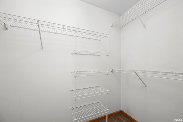 3814 Creek Hill Dr, Bettendorf, IA 52722 - spacious closet featuring wood finished floors