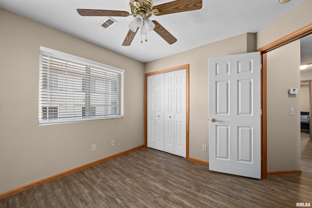 3814 Creek Hill Dr, Bettendorf, IA 52722 - unfurnished bedroom featuring wood finished floors, baseboards, a closet, and ceiling fan