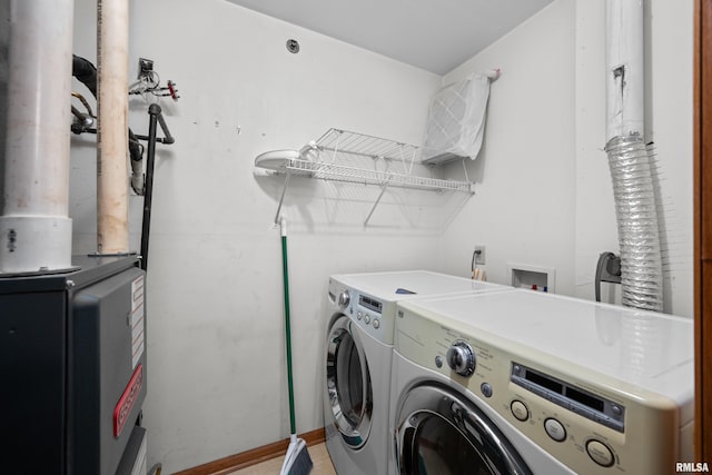 3814 Creek Hill Dr, Bettendorf, IA 52722 - laundry room with washing machine and clothes dryer and heating unit