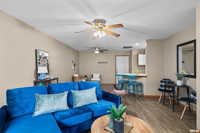 3814 Creek Hill Dr, Bettendorf, IA 52722 - living room with a ceiling fan, wood finished floors, baseboards, and a textured ceiling
