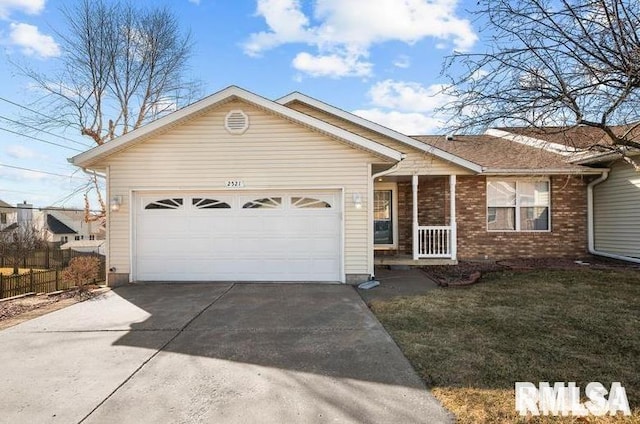 2521 W 63rd St, Davenport, IA 52806 - ranch-style house with concrete driveway, an attached garage, and brick siding