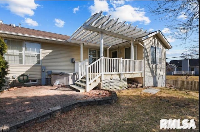 2521 W 63rd St, Davenport, IA 52806 - rear view of house with a hot tub, a pergola, and a wooden deck
