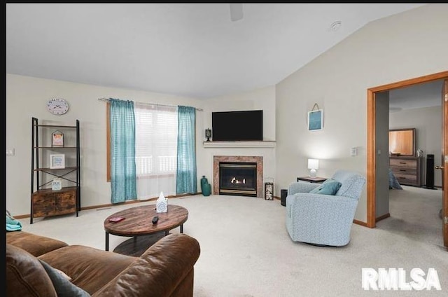 2521 W 63rd St, Davenport, IA 52806 - living area with light colored carpet, lofted ceiling, and a warm lit fireplace