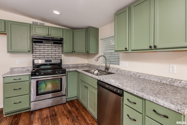 1104 E Lindell St, West Frankfort, IL 62896 - kitchen featuring appliances with stainless steel finishes, under cabinet range hood, green cabinets, a sink, and lofted ceiling