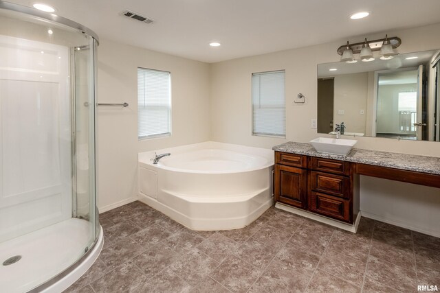 1104 E Lindell St, West Frankfort, IL 62896 - full bathroom with a stall shower, vanity, a bath, and recessed lighting