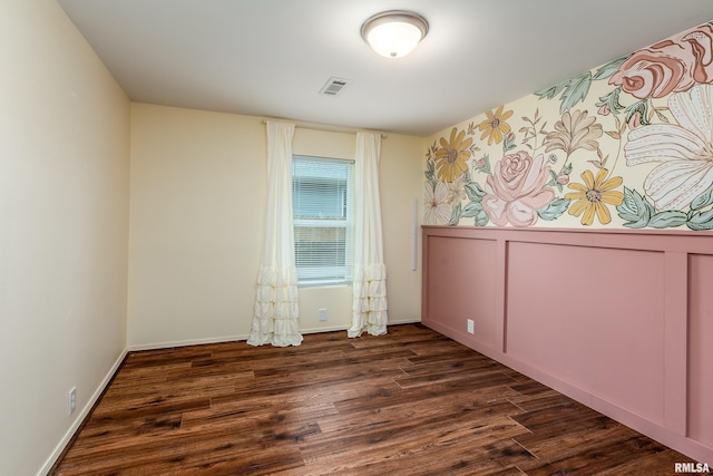 1104 E Lindell St, West Frankfort, IL 62896 - unfurnished room with dark wood-type flooring and baseboards
