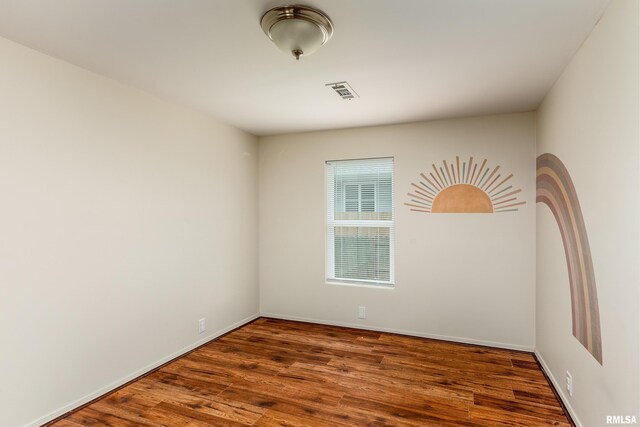1104 E Lindell St, West Frankfort, IL 62896 - unfurnished room featuring wood finished floors and baseboards
