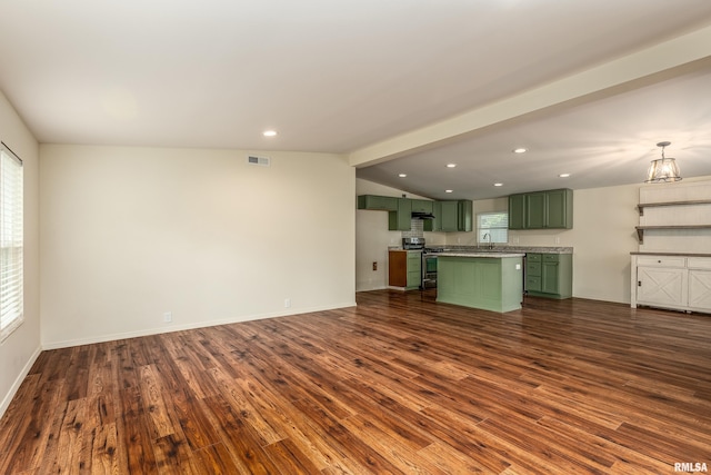 1104 E Lindell St, West Frankfort, IL 62896 - unfurnished living room with dark wood finished floors, recessed lighting, vaulted ceiling, a sink, and baseboards