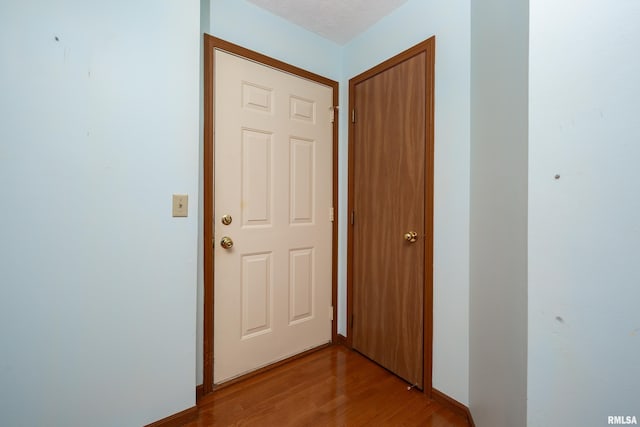 4675 Kynnelworth Dr Unit 301, Bettendorf, IA 52722 - hallway featuring wood finished floors