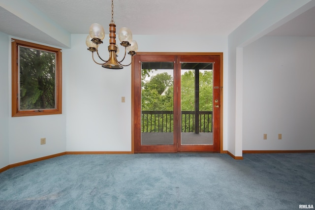4675 Kynnelworth Dr Unit 301, Bettendorf, IA 52722 - carpeted spare room with a chandelier and baseboards