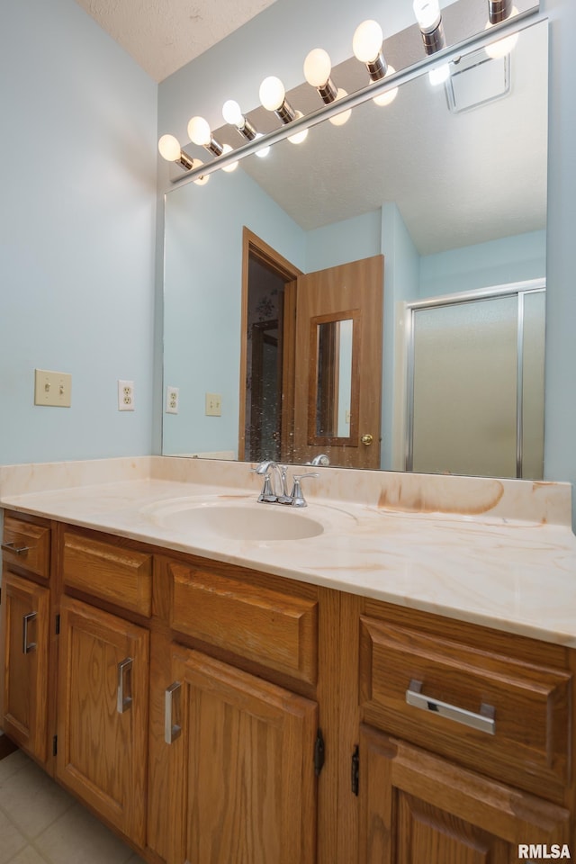 4675 Kynnelworth Dr Unit 301, Bettendorf, IA 52722 - full bath featuring vanity, a shower stall, and tile patterned flooring