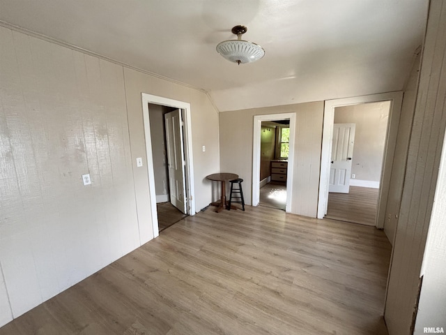 837 19th Ave, Moline, IL 61265 - empty room with light wood-style floors and lofted ceiling