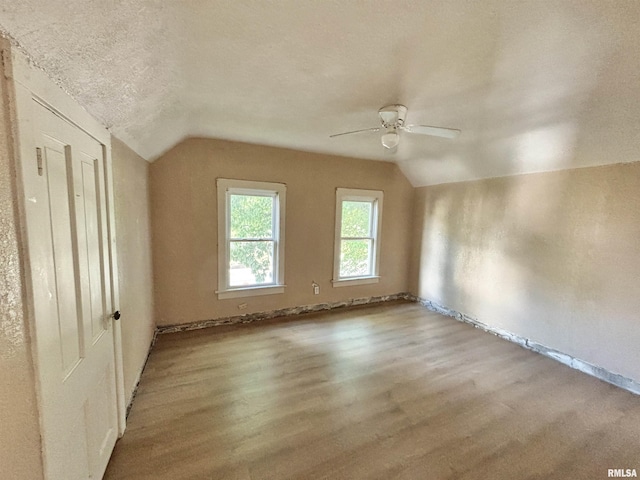 837 19th Ave, Moline, IL 61265 - unfurnished bedroom featuring lofted ceiling, wood finished floors, baseboards, and ceiling fan
