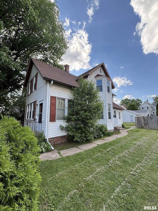 837 19th Ave, Moline, IL 61265 - view of property exterior featuring a chimney and roof with shingles