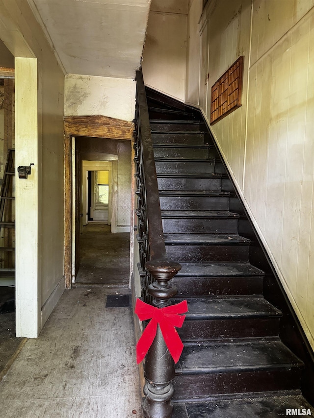 706 Farnam St, Davenport, IA 52803 - staircase featuring wooden walls