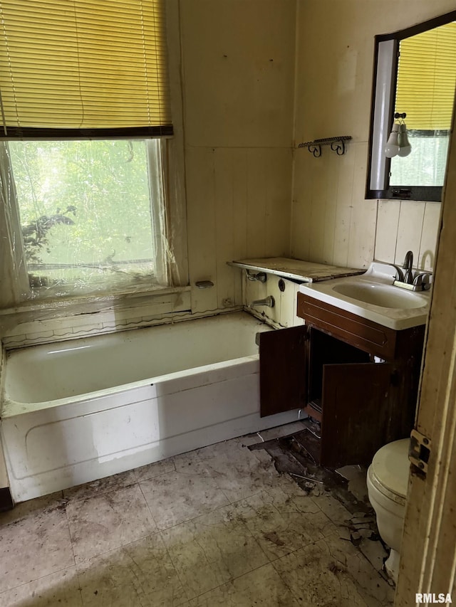 706 Farnam St, Davenport, IA 52803 - full bathroom with toilet, a tub to relax in, and vanity