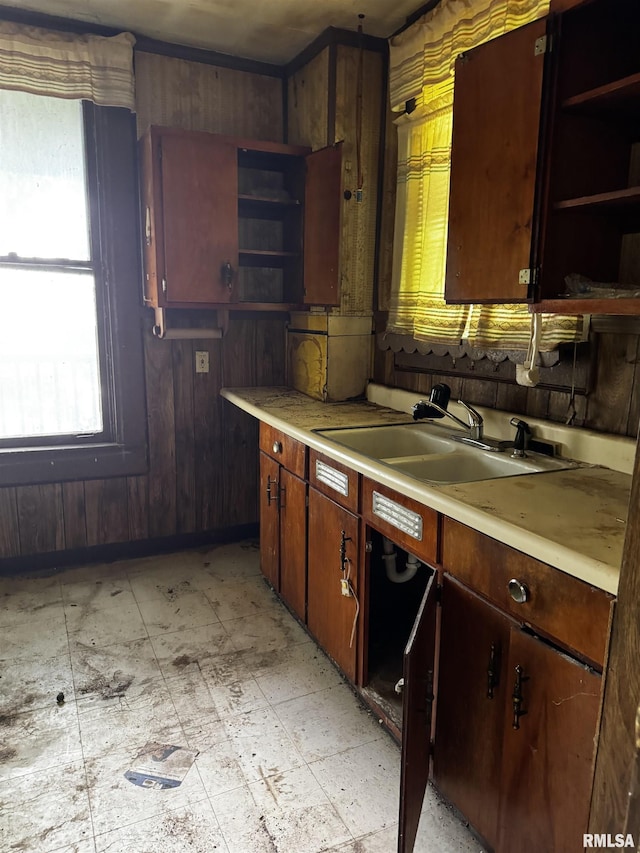706 Farnam St, Davenport, IA 52803 - kitchen featuring open shelves, a sink, light countertops, and wood walls
