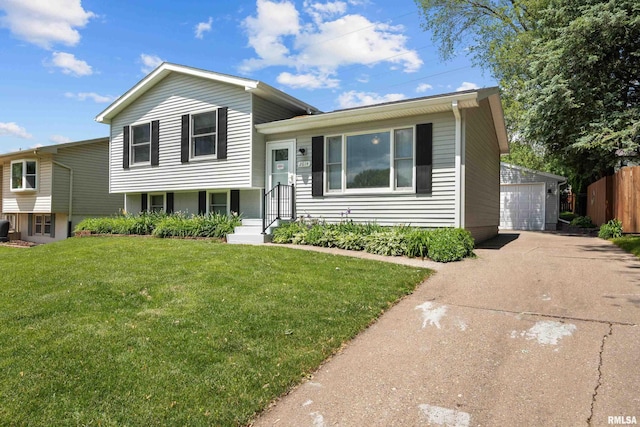 2614 W 59th St, Davenport, IA 52806 - tri-level home with an outdoor structure and a garage