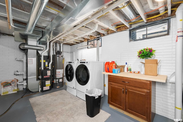 2614 W 59th St, Davenport, IA 52806 - laundry room with separate washer and dryer, brick wall, gas water heater, plenty of natural light, and heating unit
