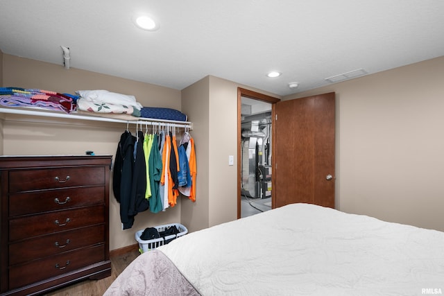 2614 W 59th St, Davenport, IA 52806 - bedroom with wood finished floors and recessed lighting