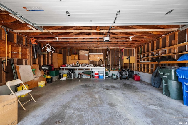2614 W 59th St, Davenport, IA 52806 - garage featuring a garage door opener