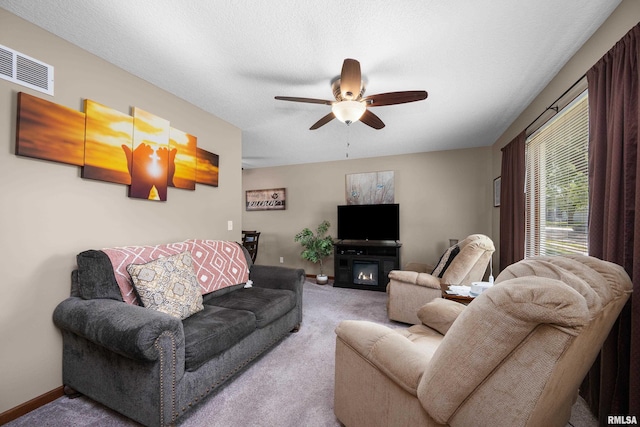 2614 W 59th St, Davenport, IA 52806 - living area featuring carpet floors, ceiling fan, and baseboards