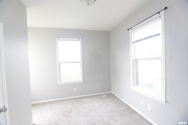 1502 N Ripley St, Davenport, IA 52803 - carpeted empty room with baseboards