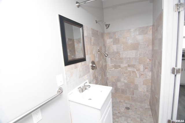 1502 N Ripley St, Davenport, IA 52803 - bathroom featuring a tile shower, vanity, and tile walls