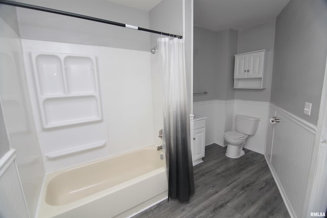 1502 N Ripley St, Davenport, IA 52803 - bathroom featuring toilet, wood finished floors, shower / bath combo, and a wainscoted wall