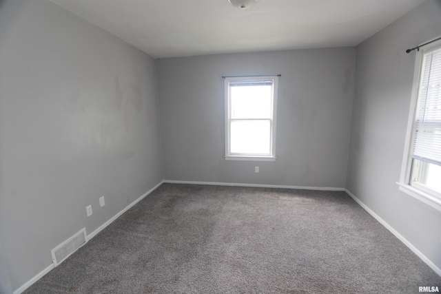 1502 N Ripley St, Davenport, IA 52803 - carpeted empty room with healthy amount of natural light and baseboards
