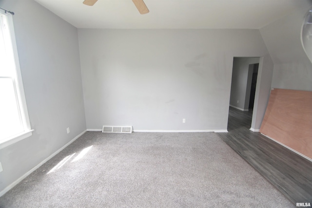 1502 N Ripley St, Davenport, IA 52803 - spare room featuring ceiling fan, baseboards, carpet flooring, and lofted ceiling