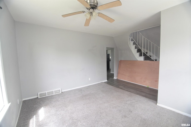 1502 N Ripley St, Davenport, IA 52803 - carpeted spare room featuring stairs, baseboards, and ceiling fan