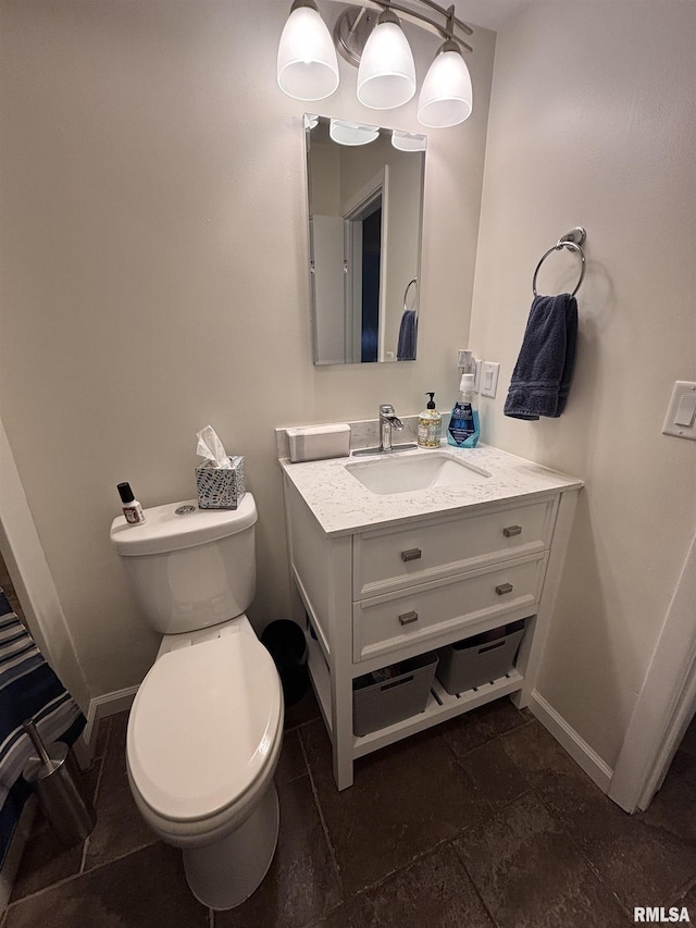 462 Circle Dr, Kewanee, IL 61443 - half bathroom with vanity, toilet, and baseboards