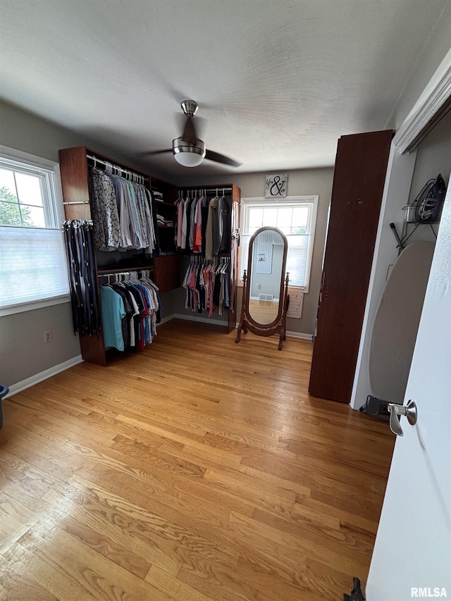 462 Circle Dr, Kewanee, IL 61443 - spacious closet with light wood-style flooring and ceiling fan