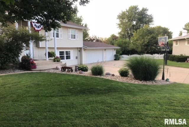 462 Circle Dr, Kewanee, IL 61443 - view of front of house featuring an attached garage, a front lawn, and driveway