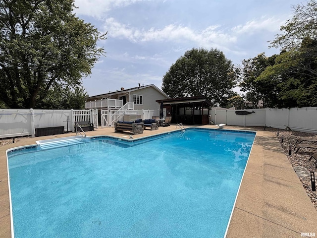 462 Circle Dr, Kewanee, IL 61443 - view of swimming pool with a deck, a fenced backyard, stairway, and a diving board